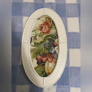 Farmhouse style antique frame with vintage fabric floral picture.
